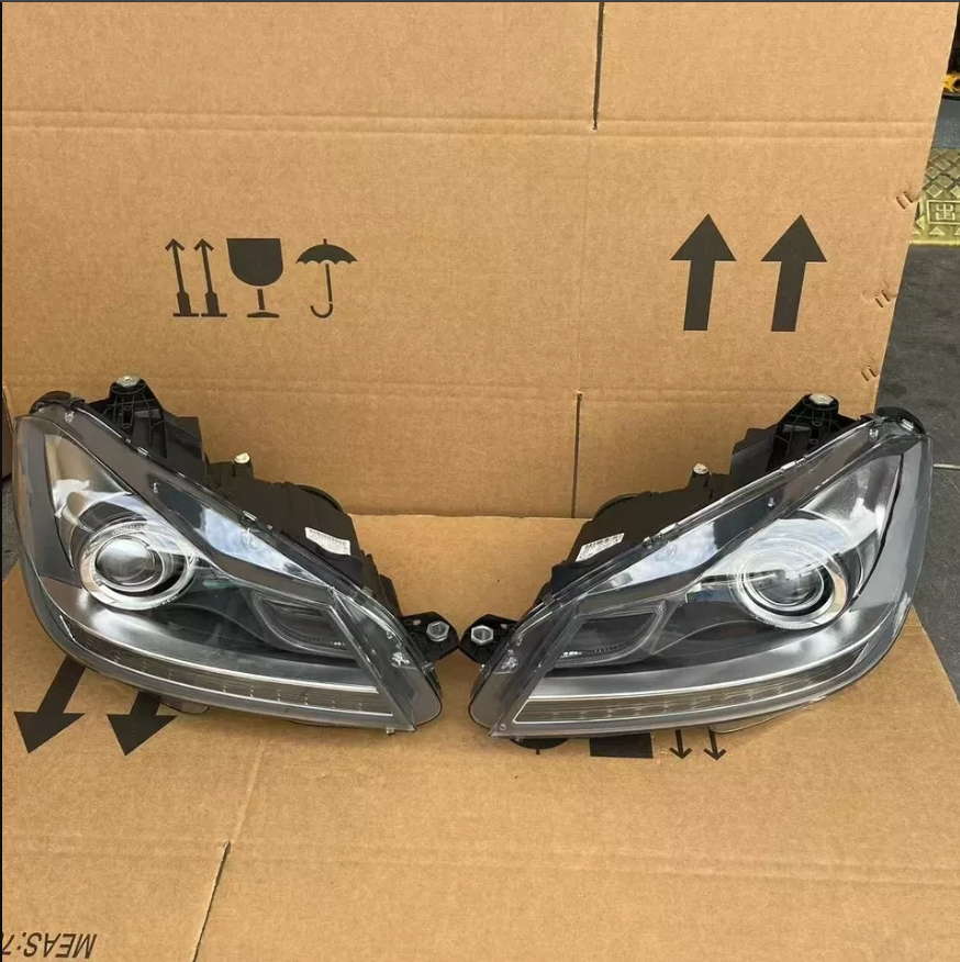 Two Silver Mercedes Benz Headlights