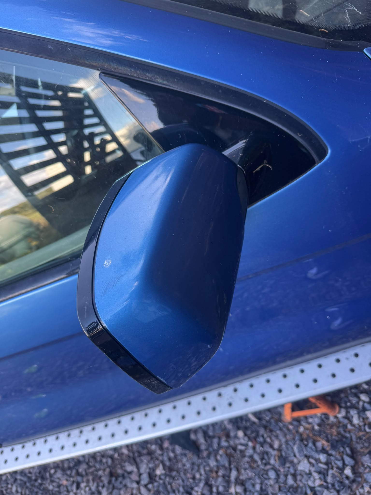 Blue BMW X5 right wing mirror
