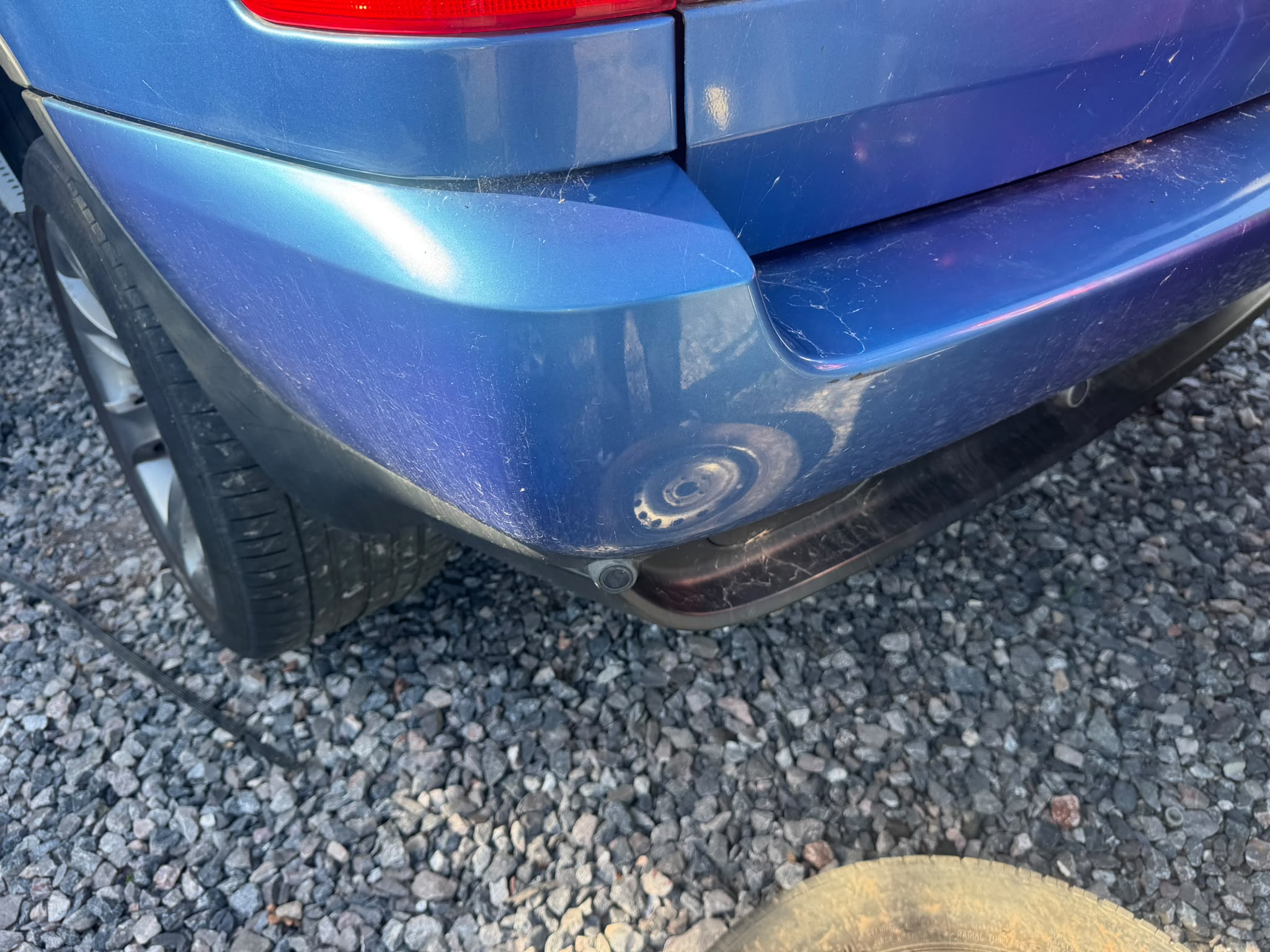Blue BMW X5 rear bumper